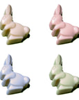 slowcocoa craft chocolate Easter bunnies in white, pink, purple and green, in a grid along white background