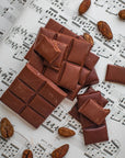 chocolate bar, cacao beans on a music sheet