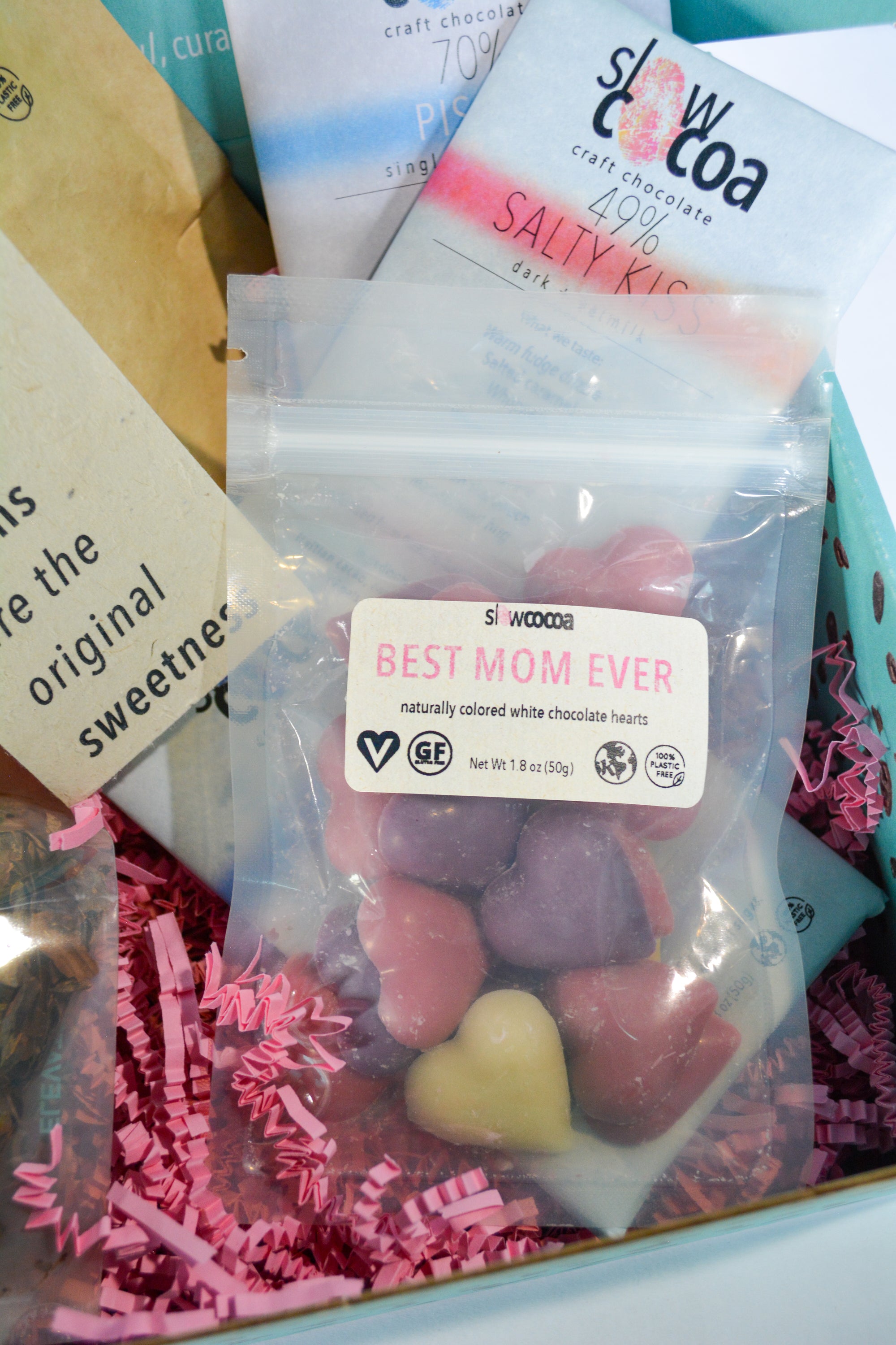 Packaged candy with a 'Best Mom Ever' label and visible brand name on a colorful background.
