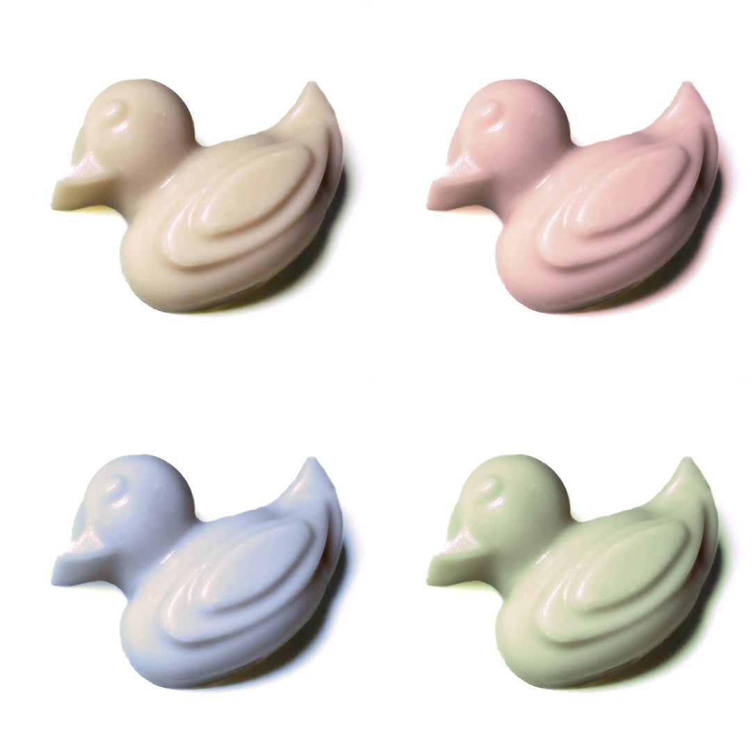 slowcocoa craft chocolate Easter ducks in white, pink, purple and green, in a grid along white background