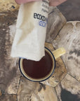 slowcocoa Mindful Drinking Chocolate, hand-poured into a mug on a marble tabletop