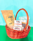 Basket with slowcocoa products on a green and blue background